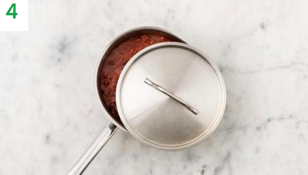 Bring the chilli to the boil, then cover with a lid and turn the heat to low.
Leave to simmer for the remaining sweet potato cooking time. Stir occasionally to stop the chilli from sticking.