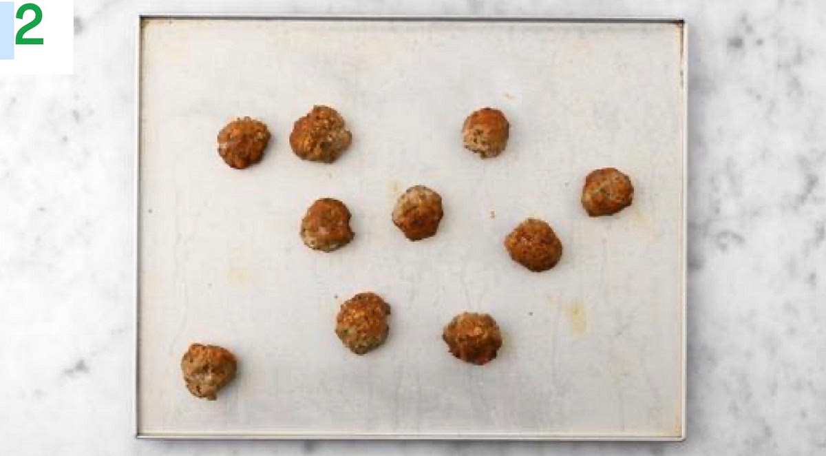 Pop the meatballs onto a large baking tray.
When the oven is hot, bake on the top shelf until browned on the outside and cooked through, 12-15 mins. Once the water is boiling, add the rigatoni and bring back to the boil. Cook until tender, 12 mins.
When the pasta has been cooking for 5 mins, add the broccoli to the pan for the remaining time.
When cooked, drain the pasta and broccoli in a colander and pop back in the pan. Drizzle with oil and stir through to stop it sticking together.