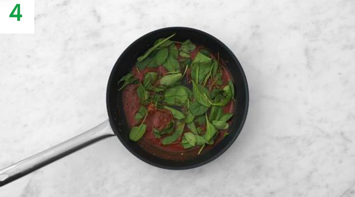 Once the sauce has thickened, add the spinach a handful at a time until wilted and piping hot, 1-2 mins.
Stir in the butter until melted.