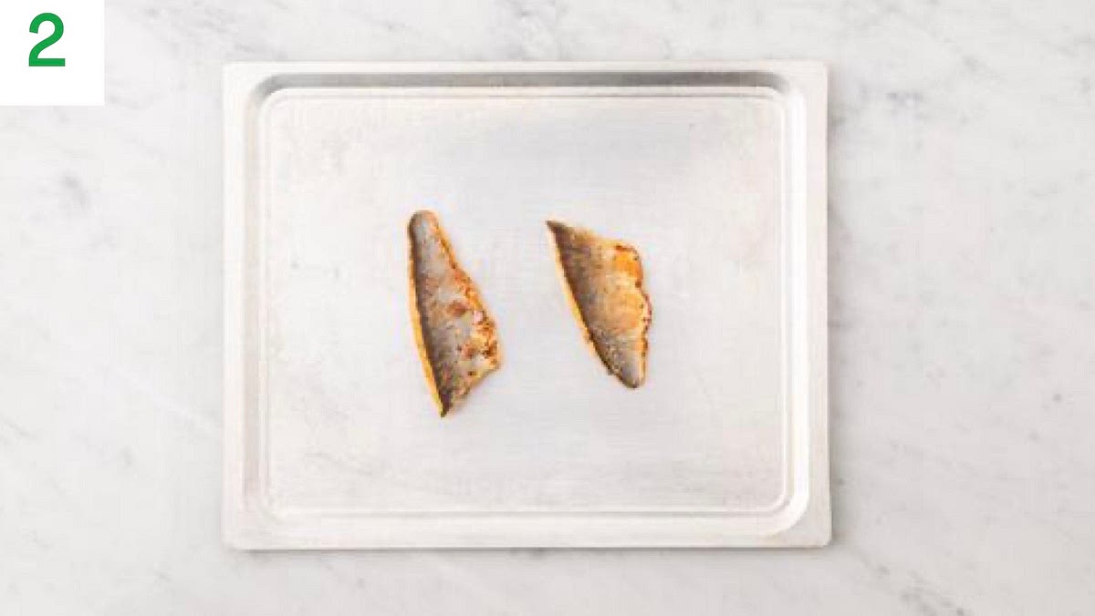 Pat the sea bream dry with kitchen paper.
Lay the sea bream, skin-side up, onto a lined baking tray. Season with salt and pepper.
When the oven is hot, bake on the middle shelf until the fish is cooked, 10-15 mins.