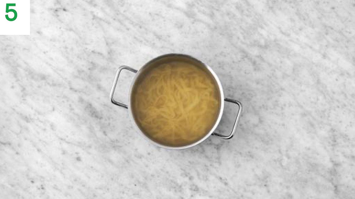 While the sauce simmers, pour the boiled water into a large saucepan with ½ tsp salt on high heat.
Add the pasta and samphire and bring back to the boil. Simmer until tender, 3-4 mins.
Once cooked, drain in a colander and pop into the pan with the creamy sauce with the prawns, then toss to coat.
Season to taste with salt and pepper.