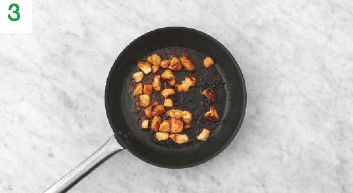 Heat a drizzle of oil in a large frying pan on medium- high heat.
Once hot, add the diced chicken to the pan, season with salt and pepper and sprinkle over the Central American style spice mix. Fry until golden brown on the outside and cooked through, 8-10 mins.