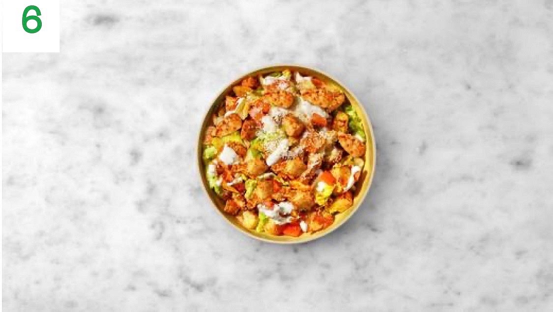 Share the salad between your bowls and sprinkle over the hard Italian style cheese.
Drizzle over the mayonnaise to finish.
