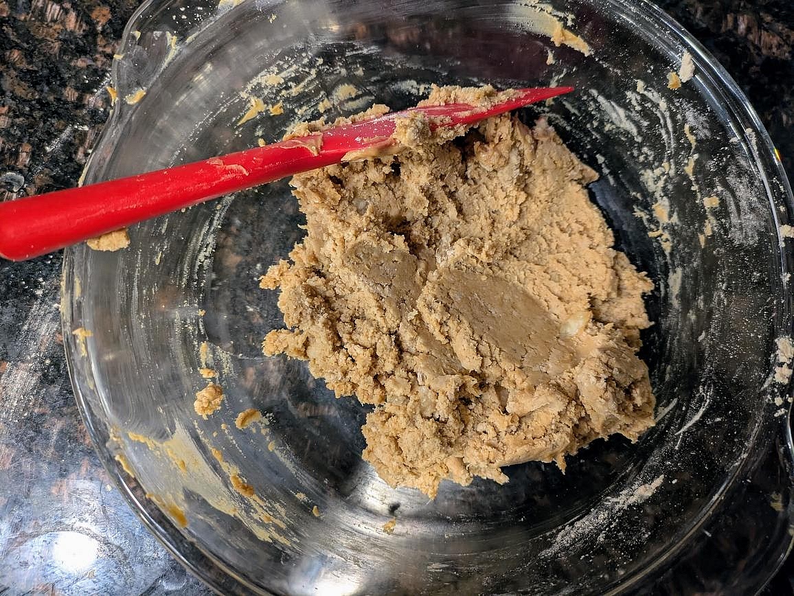 In a medium bowl, mash the banana with a fork until smooth. Add in the nut butter, protein powder, baking powder, salt, vanilla, and liquid sweetener. Mix until combined with a silicone spatula.