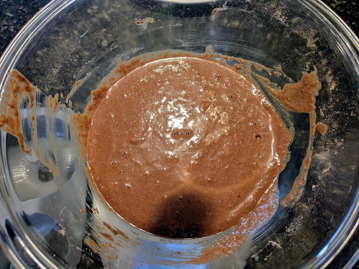 Add in the liquid ingredients, and combine with a silicone spatula - eggs, applesauce, vanilla, and allulose.