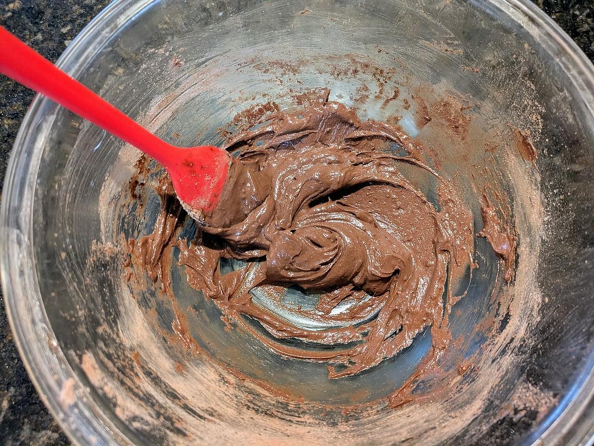 Mix together the glaze ingredients in a small bowl - yogurt, protein powder, cocoa powder, vanilla extract, and liquid monk fruit.