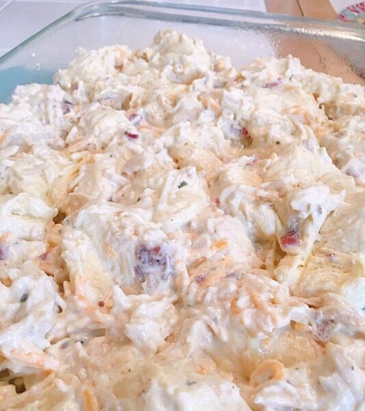 Pour chicken mixture into prepared pan. Top with the remaining cup of grated cheese.