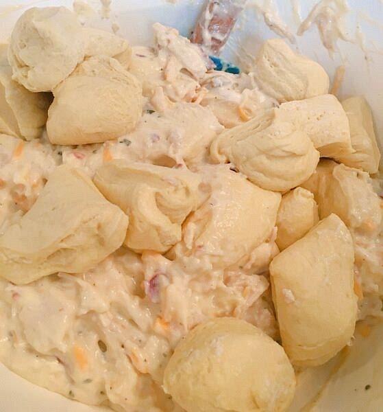 Cut each biscuit into 4 pieces. Toss with chicken mixture.
*Please note: if you do not like biscuits that are "doughy," like a dumpling, place the chicken mixture on the bottom of the dish and top it off with the biscuits!*