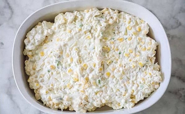 Spread the cream cheese mixture over the top of the chicken and sprinkle remaining cheese evenly over the top.
