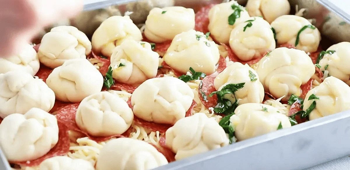 Brush each ball of dough with the butter/garlic mixture.