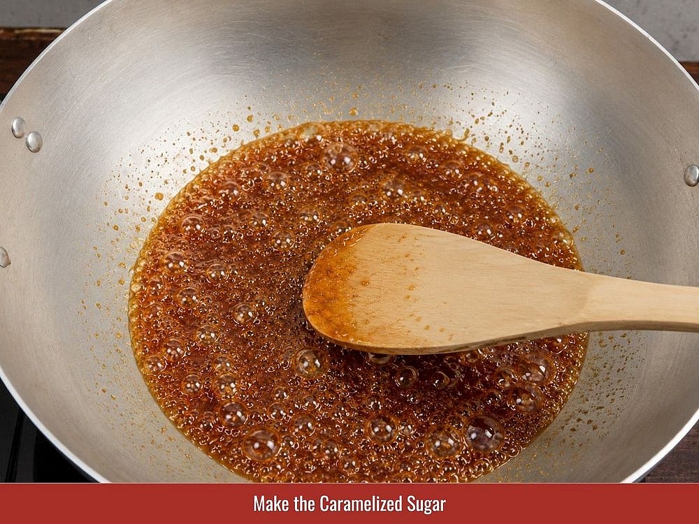 Make The Caramel Sauce
Add 3 tablespoons of sugar and a small splash of water to a saucepan over medium heat. Gently swirl the pan without stirring until the sugar melts and turns deep amber, about 3–4 minutes. Carefully add 2 tablespoons of water to stop the cooking process. Stir briefly, remove the pan from the heat, and set the caramel sauce aside.