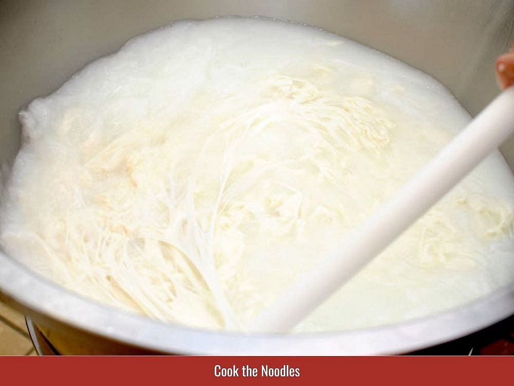 Prepare The Rice Vermicelli
Separate fresh rice vermicelli strands and arrange them on a serving plate. When using dried rice vermicelli, bring a pot of water to a boil and cook the noodles according to the package instructions, usually for 3–5 minutes. Drain and rinse under cold running water, then set aside.