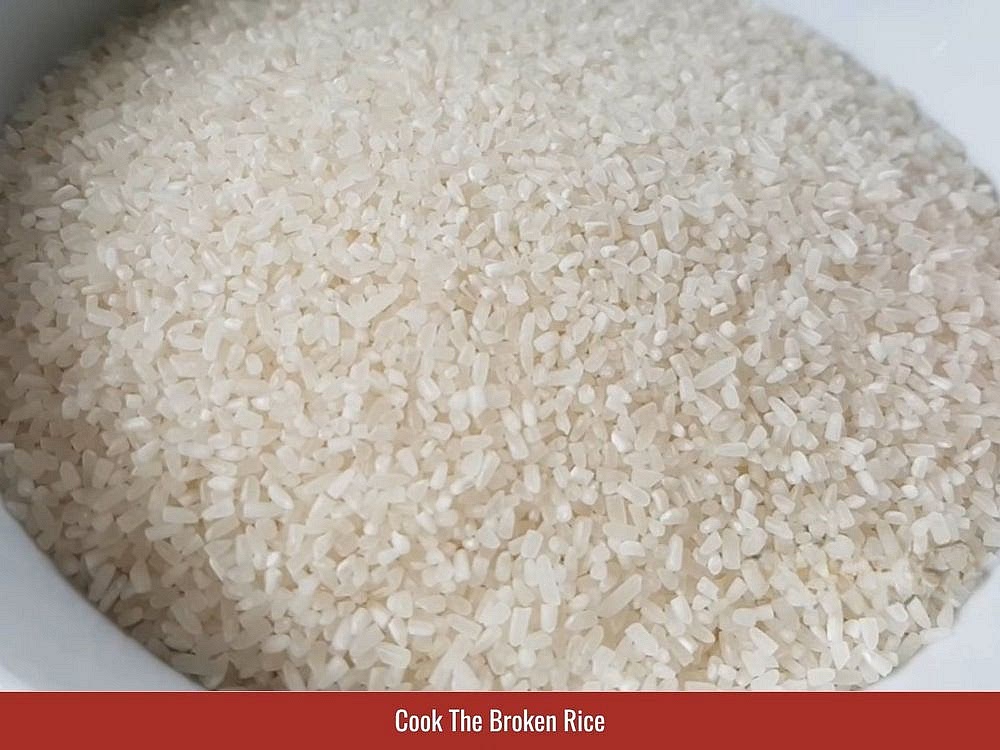 Cook The Broken Rice
Rinse the broken rice twice under cold water. Avoid excessive rinsing because the starch helps create the characteristic soft, slightly clingy texture. Transfer the rice to a rice cooker. Add enough water to sit approximately 1/4 inch (0.5 centimeter) above the grains. Cook using the normal rice setting, then fluff gently before serving.