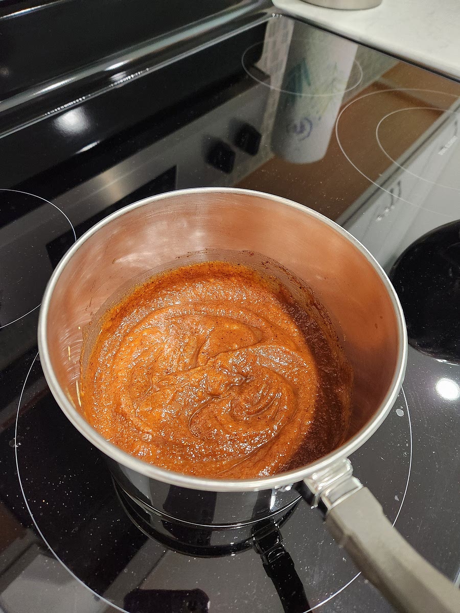 Put the blended carrots into a medium saucepan that has a lid. Add the remaining ingredients: dash garlic powder, dash onion powder, drizzle maple syrup, small splash of apple cider vinegar, dash salt, and stir with fork. This makes ketchup, now we turn it into bbq sauce. Next add 1/4 cup coconut sugar, 1 1/2 tsp chili powder blend, 1 tsp smoked paprika, 1/2 tsp onion powder, 1 pinch cayenne, 1/8 tsp salt, 1/8 tsp ground pepper, 1 1/2 Tbsp apple cider vinegar, 1 Tbsp lemon juice, 1/2 Tbsp soy sauce, 1/2 tsp dijon mustard, and stir. Put in a medium saucepan, bring to boil, cover with lid, turn heat to low and simmer 10 min. Bbq sauce is done and ready to use!