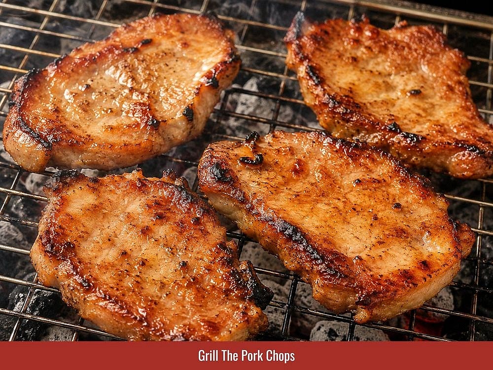 Grill The Pork Chops
Take the marinated pork out of the fridge and brush off the bits of aromatics clinging to the surface, which keeps them from scorching. Clamp the meat in a grilling rack and set it over charcoal. Start at 2 to 3 minutes per side, then keep turning for about 20 minutes total, until it's golden-charred and cooked through. The sugar, condensed milk, and fresh milk in the marinade color the meat on their own, so there's no need to baste. Take it to an internal 145°F (63°C) to be safe. If a charcoal grill is unavailable, the pork can still be cooked in an oven or an air fryer; the exact temperatures and timing are covered in the Substitutions section.