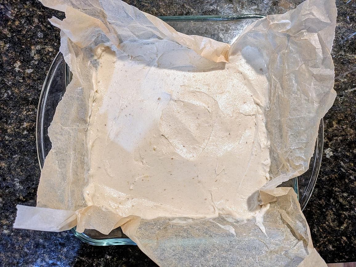 Line a 9" square pan with parchment paper. Spread the banana ice cream into an even layer on top of the pan.
