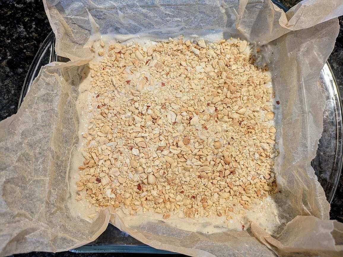 Sprinkle your peanuts over the nice cream, and lightly press in with a silicone spatula.
