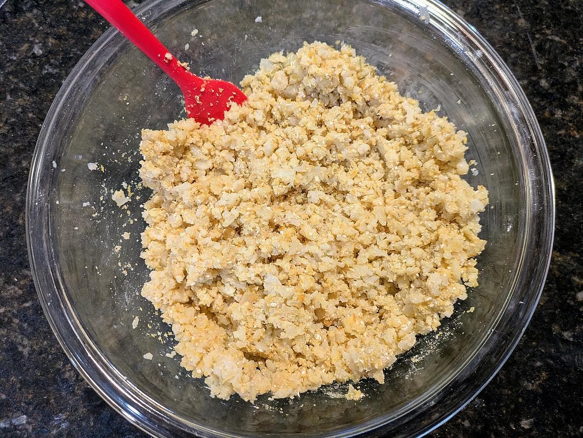 Add in the dry ingredients, and whisk together - almond flour, oat flour, nutritional yeast, rosemary, baking powder, garlic powder, onion powder, and salt.