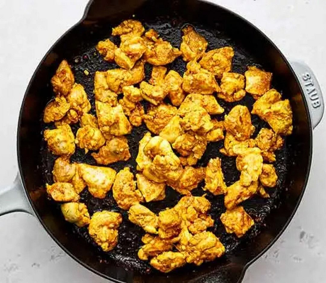 Heat a pan with a little oil or butter over medium-high heat. Cook the chicken pieces until brown on the outside. Take them out of the pan.