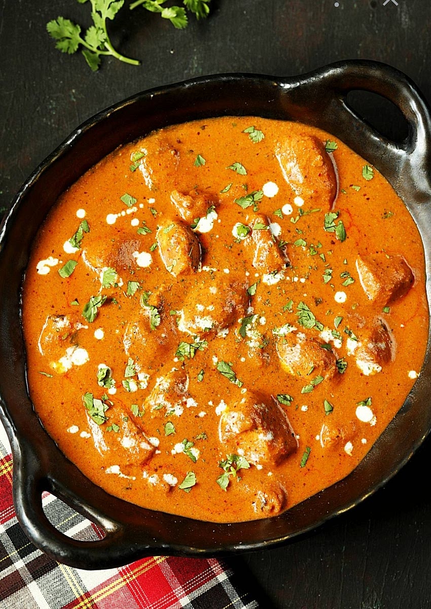 Put the butter in the same pan. Cook the onion, garlic, and ginger until soft. Add the tomato passata, salt, and sugar. Let it bubble for 10 minutes.