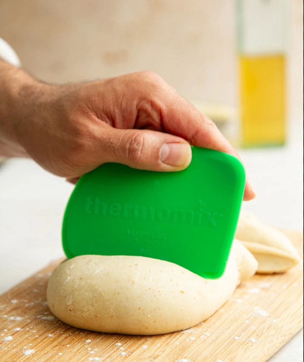 Divide the dough into 6 equal balls. Roll each ball into an oval shape about 1/8-inch thick.
