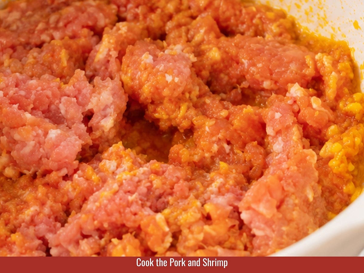 Cook pork and shrimp with aromatics, then combine with soybean sauce, hoisin sauce, peanut butter, and seasonings. Blend and thicken until smooth.
