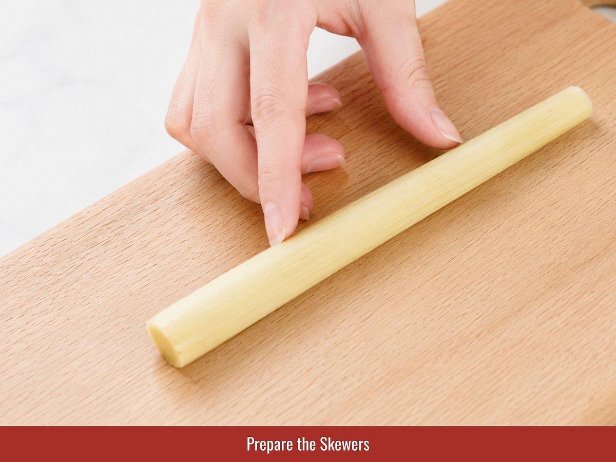 Cut sugarcane into 5–6 inch (12–15 cm) sticks. Split thicker pieces lengthwise until each stick is easier to wrap with shrimp paste.