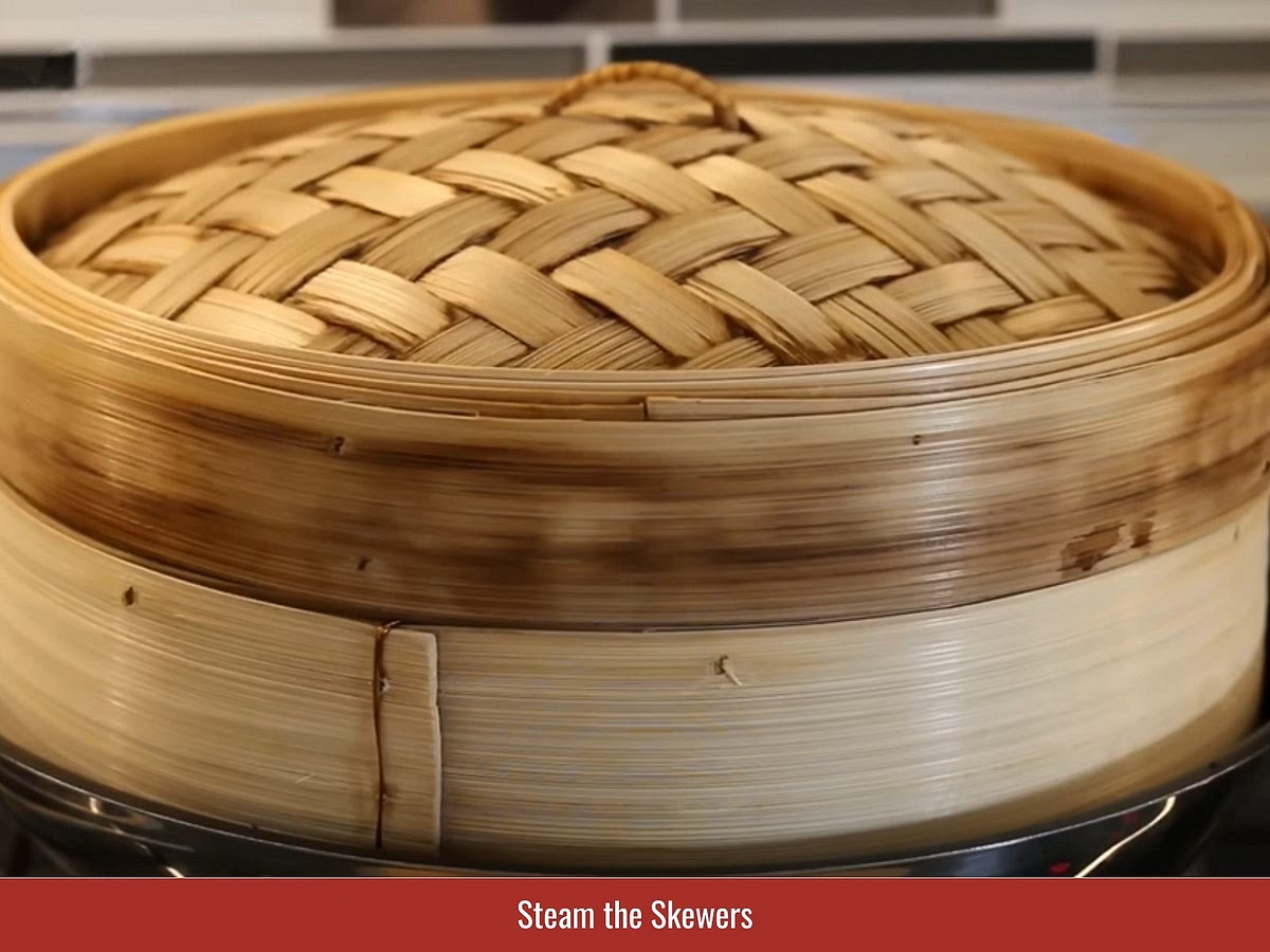 Steam the shaped skewers until the shrimp paste sets and holds its shape before frying or grilling.