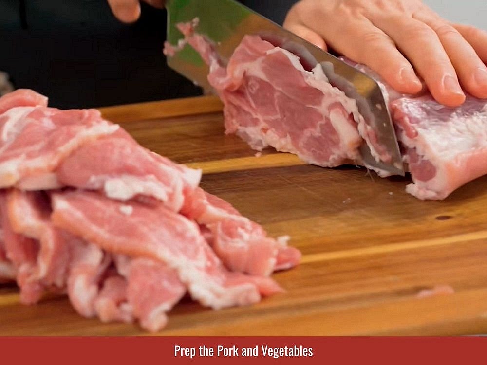 Pat the pork loin dry and slice it into thin pieces. Lightly pound the slices to help the marinade penetrate and create tender grilled pork.