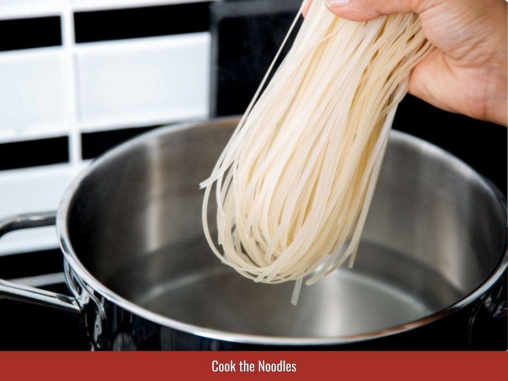 Separate fresh vermicelli and prepare lettuce, cucumber, bean sprouts, herbs, and roasted peanuts for assembly.