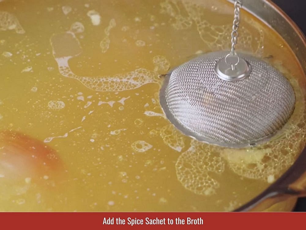 Add charred aromatics and spice bag to the broth. Continue simmering until the beef becomes tender and the broth develops a deep pho aroma.