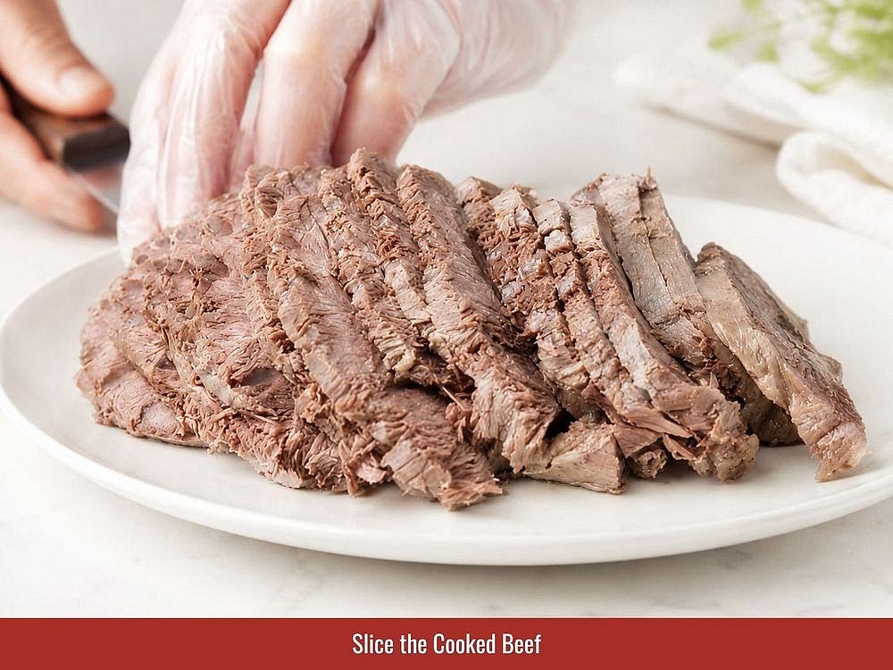 Slice cooked brisket and beef muscle thinly. Prepare green onions, cilantro, herbs, bean sprouts, lime, and chili for serving.