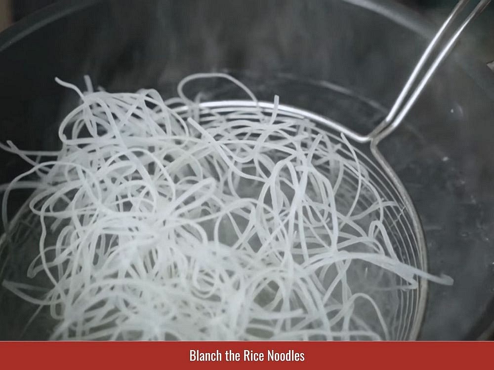 Blanch rice noodles briefly until soft, then drain immediately to maintain their texture.
