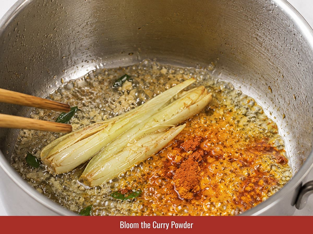 Add marinated chicken and stir-fry until the outside becomes firm and coated with curry oil.