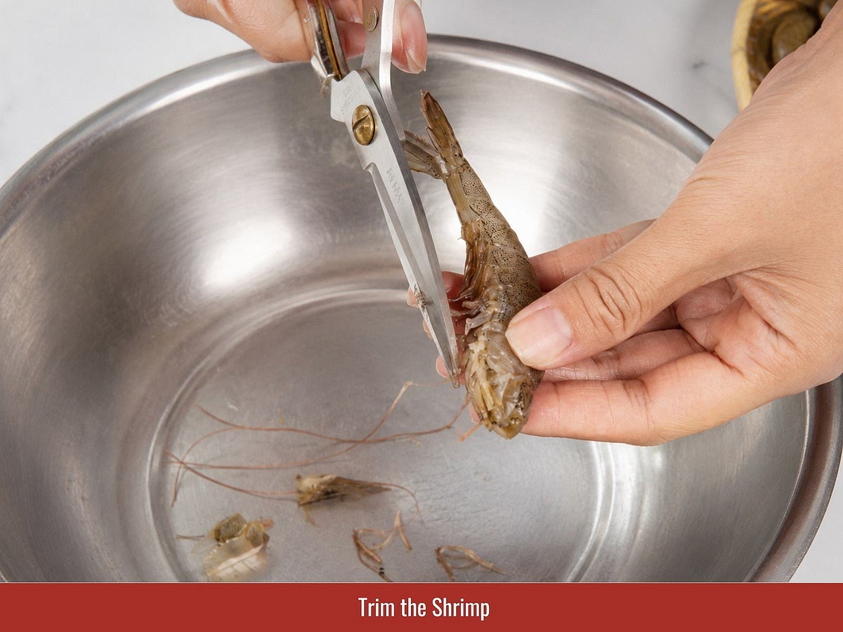 Trim the sharp tips from shrimp heads, remove the vein, and keep the shell and tail intact. Keeping the shell helps the shrimp retain moisture and allows more glaze to cling during cooking.