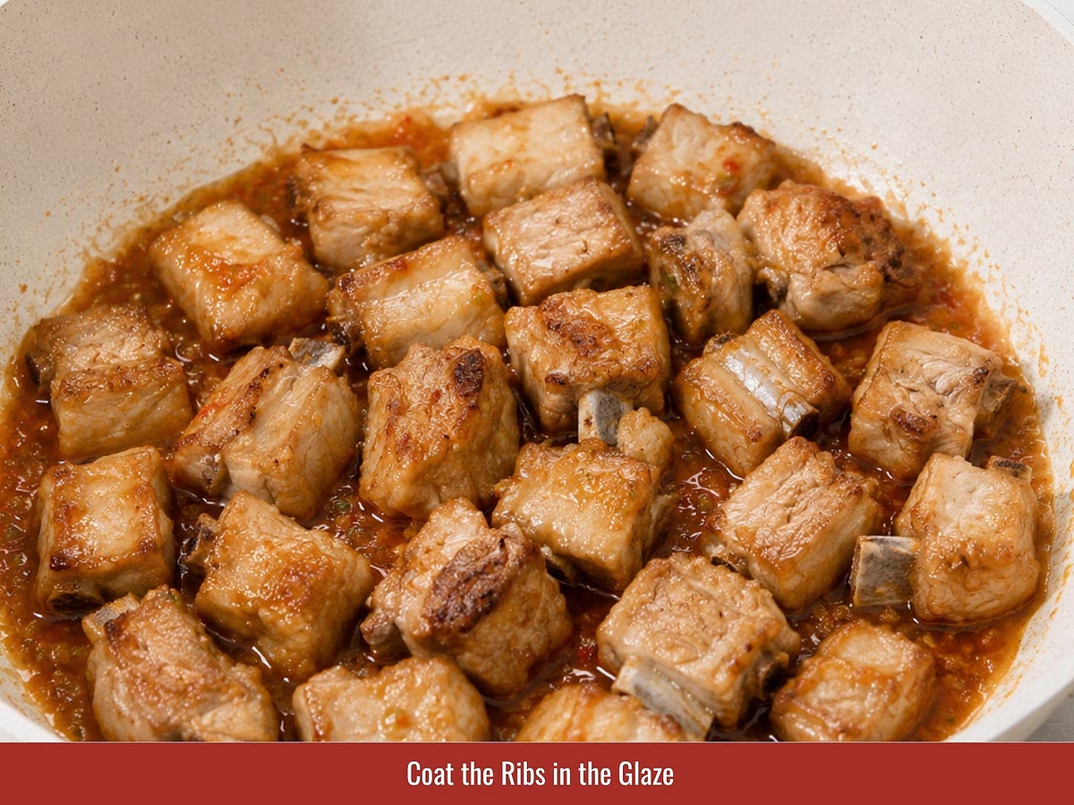 Return the fried ribs to the skillet and toss them with the glaze. Cover and simmer over low heat until the ribs become tender and the sauce reduces into a glossy coating.