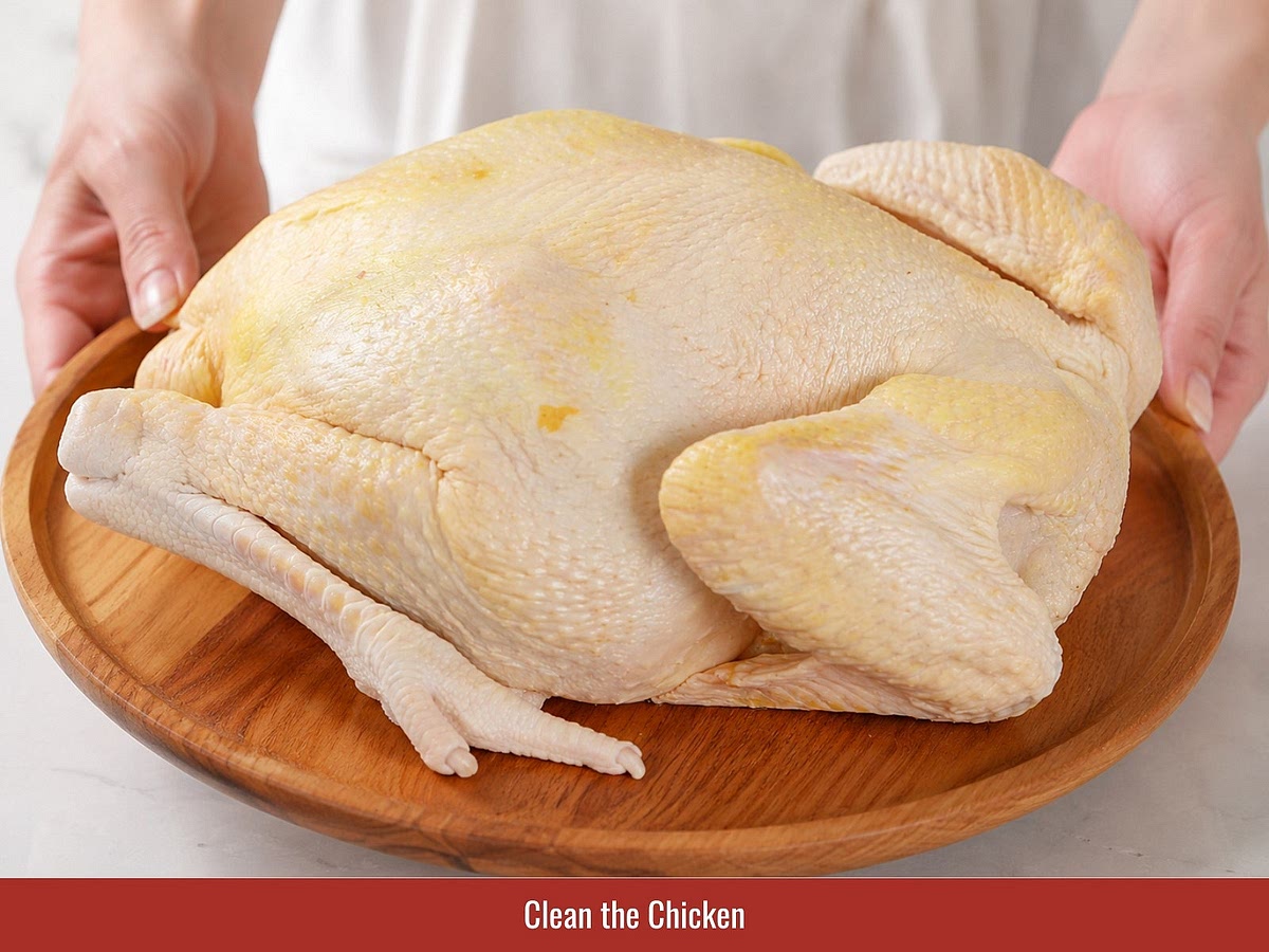 Rub the chicken skin and cavity with salt and lime juice, then rinse thoroughly and pat dry. Remove excess fat from the cavity and reserve it for making chicken fat.