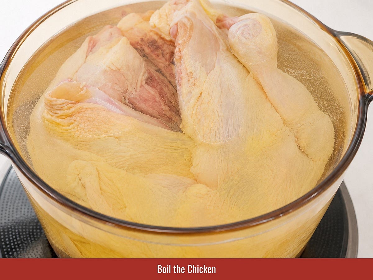 Heat water until warm, then dip the whole chicken several times to tighten the skin. Add turmeric, ginger, shallots, onion, salt, seasoning powder, and rock sugar. Simmer until cooked, then rest the chicken in the broth.