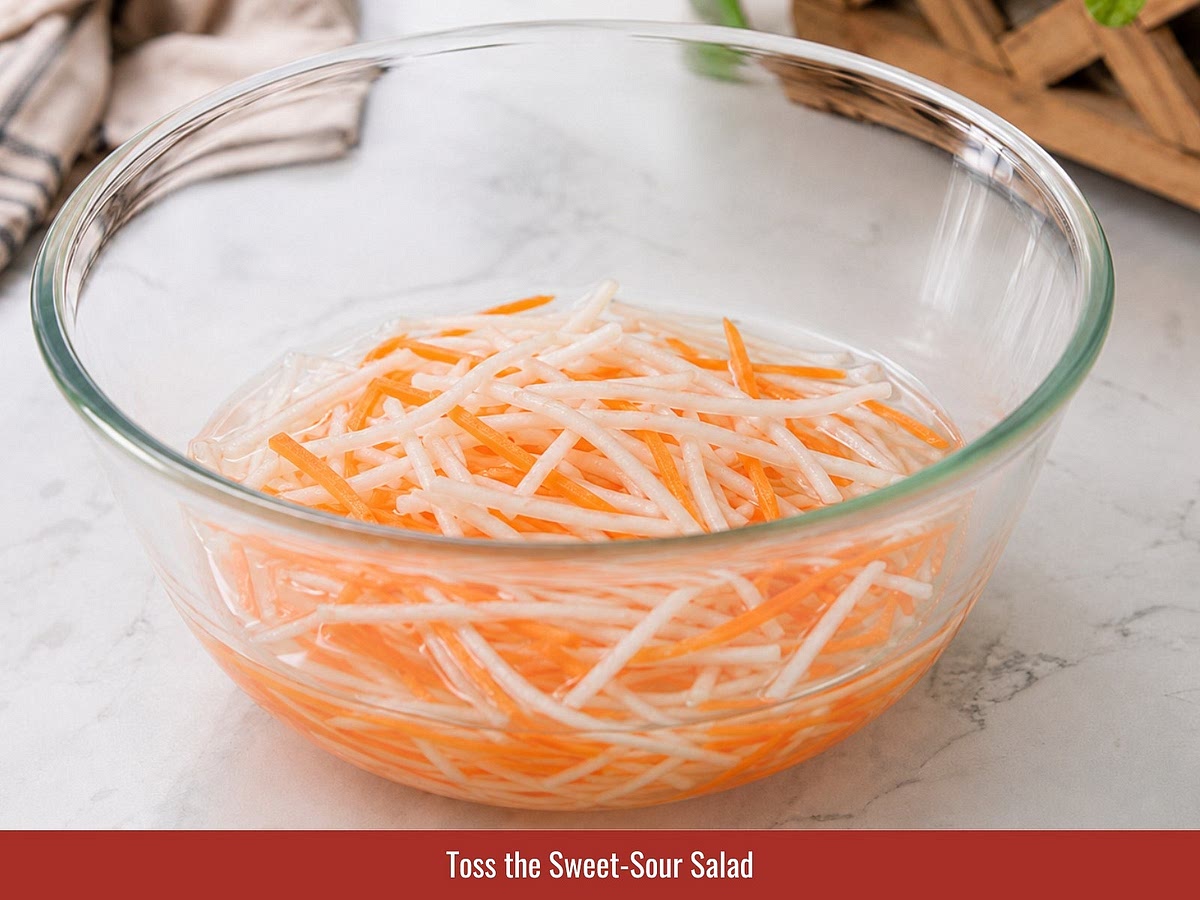 Combine shredded papaya, carrots, and onions with sugar, fish sauce, and lime juice. Add Vietnamese coriander and chili before serving.