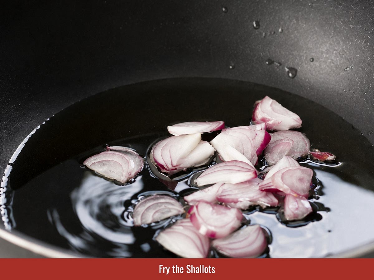 Slice shallots thinly and fry until golden and crispy. Drain and reserve for topping.
