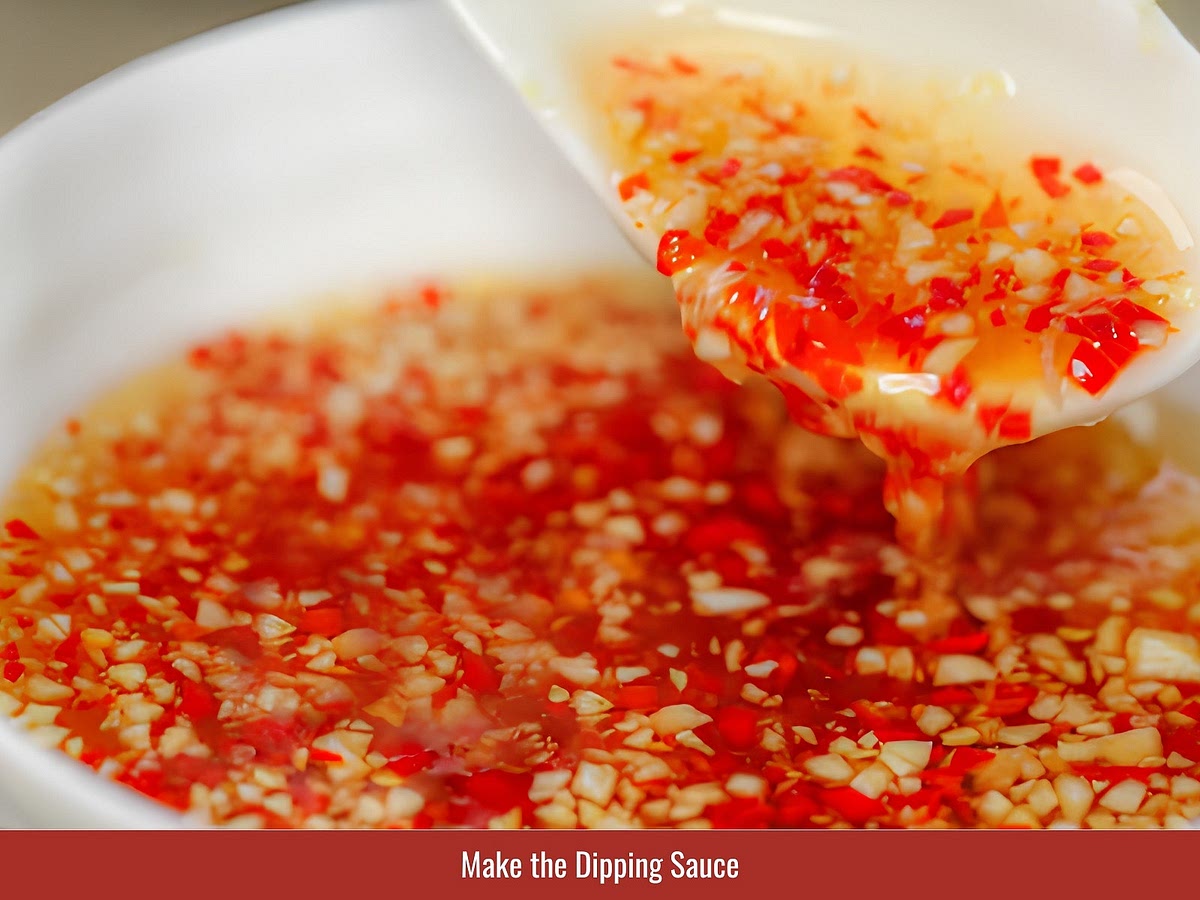 Mix fish sauce, lime juice, sugar, and water until the sugar dissolves. Add minced garlic and sliced chili for aroma and heat.