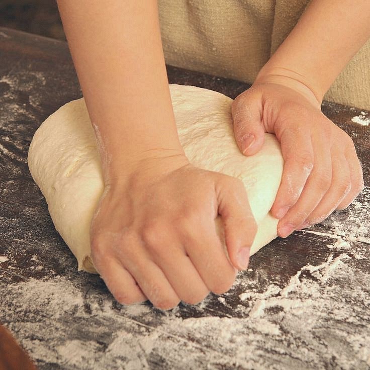 Pour the flour onto the line and gradually add lukewarm water to it to create a firm, smooth dough. Wrap it in cling film and put it in the fridge for 30 minutes.