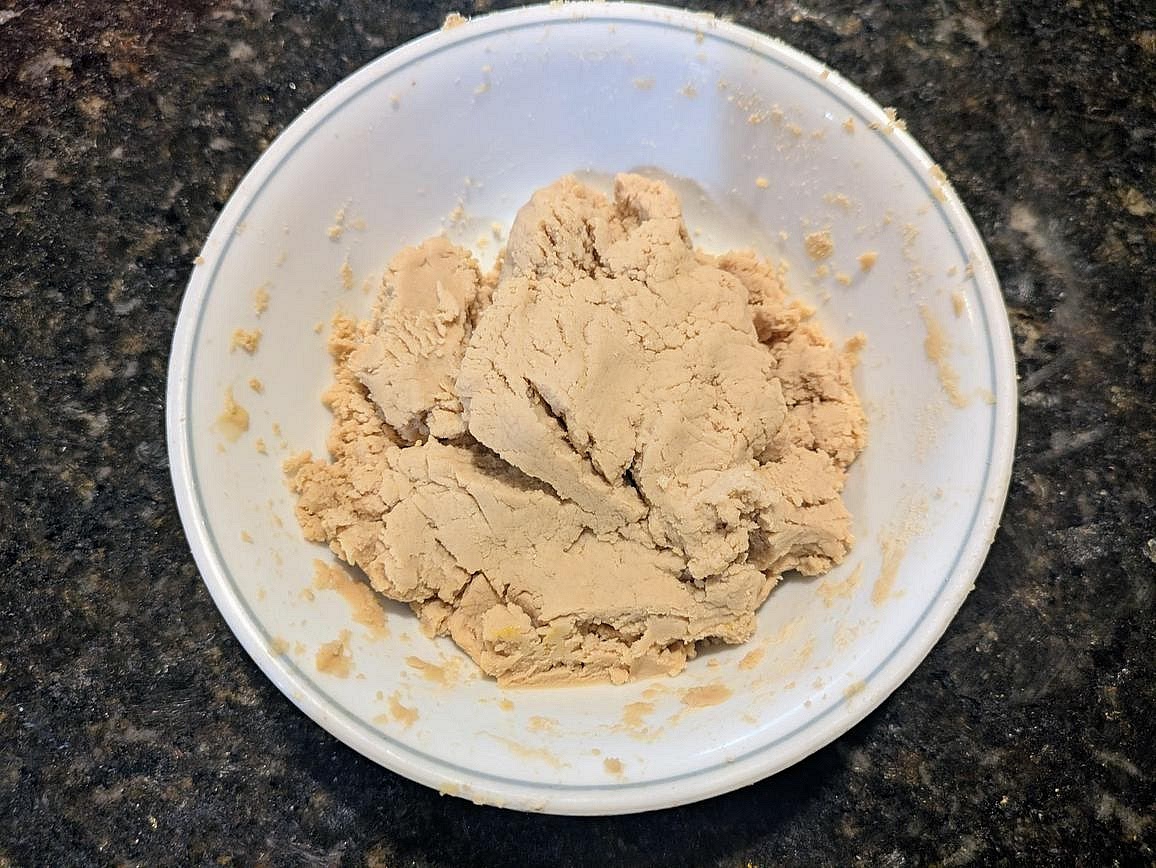 Add ingredients to a small bowl. Wearing a kitchen glove to prevent sticking, mix together with your hand to form a dough.
