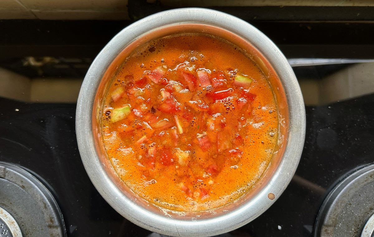Bring the concoction to boil till the tomatoes soften. Keep stirring in between. Boil for roughly 10 mins, then switch off the gas.
