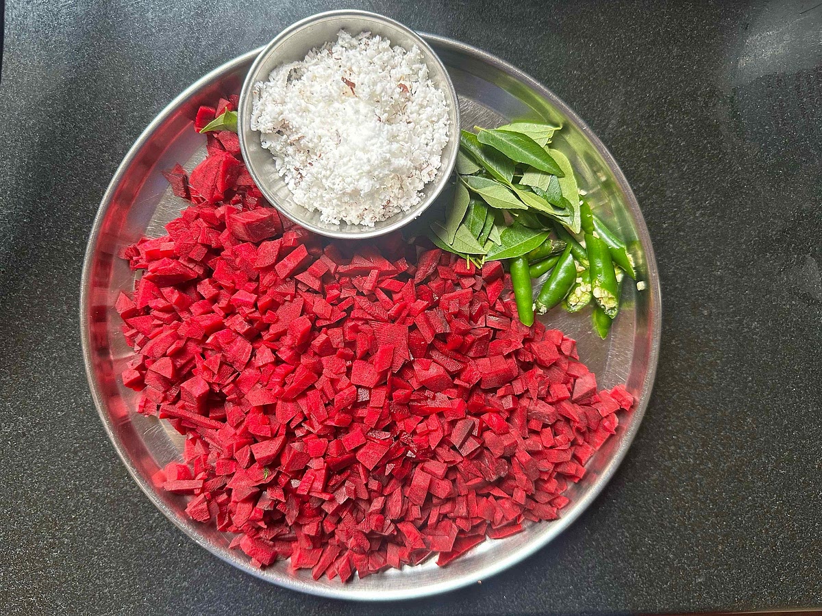 Dice beetroot into small cubes, slit green chillies in half, grate coconut, and keep curry leaves aside.