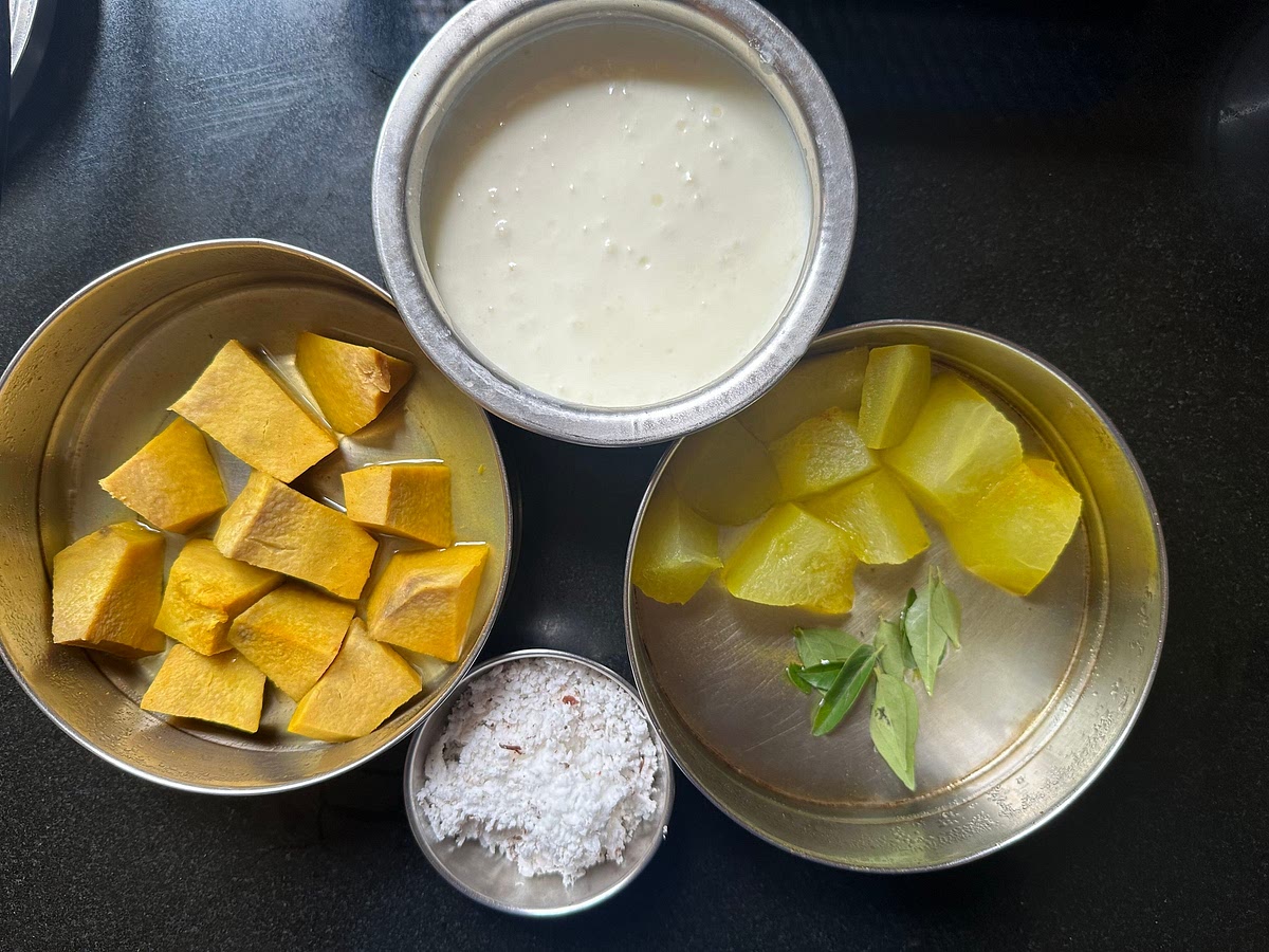 Ingredients needed for moru kootan. Chop white pumpkin and yam into big chunks and boil them in cooker (2 whistles) with pinch of haldi and salt. Beat curds and keep it aside. The curd should be a little sour, so keep it outside for at least 2-3 hours before cooking.
