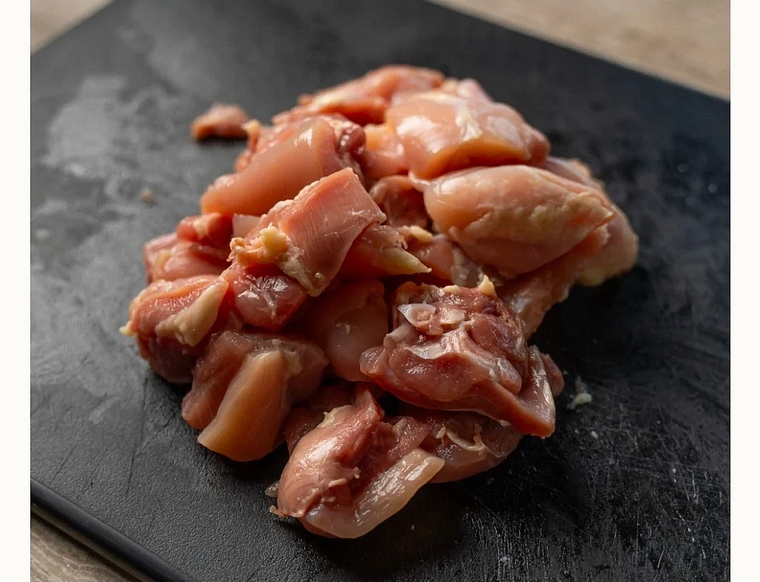 Cut boneless, skinless chicken thighs into bite-sized pieces and trim off any excess fat