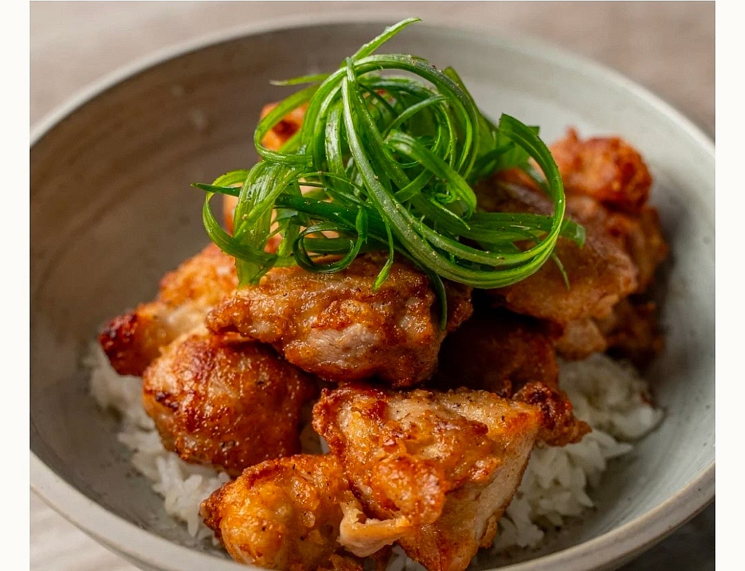 Serve over hot white jasmine rice. Garnish with green onions, black pepper, and a lime wedge. Enjoy!