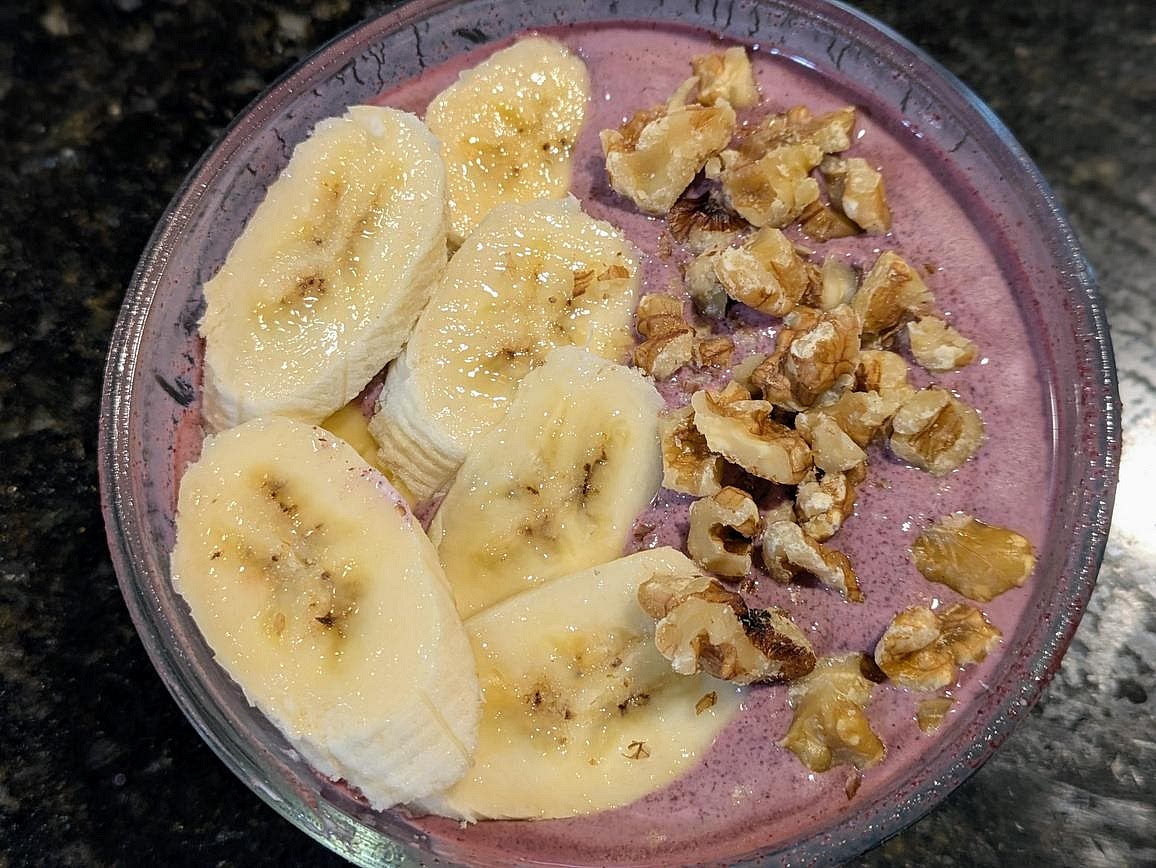 Top with sliced banana and chopped walnuts (or whatever else you want).