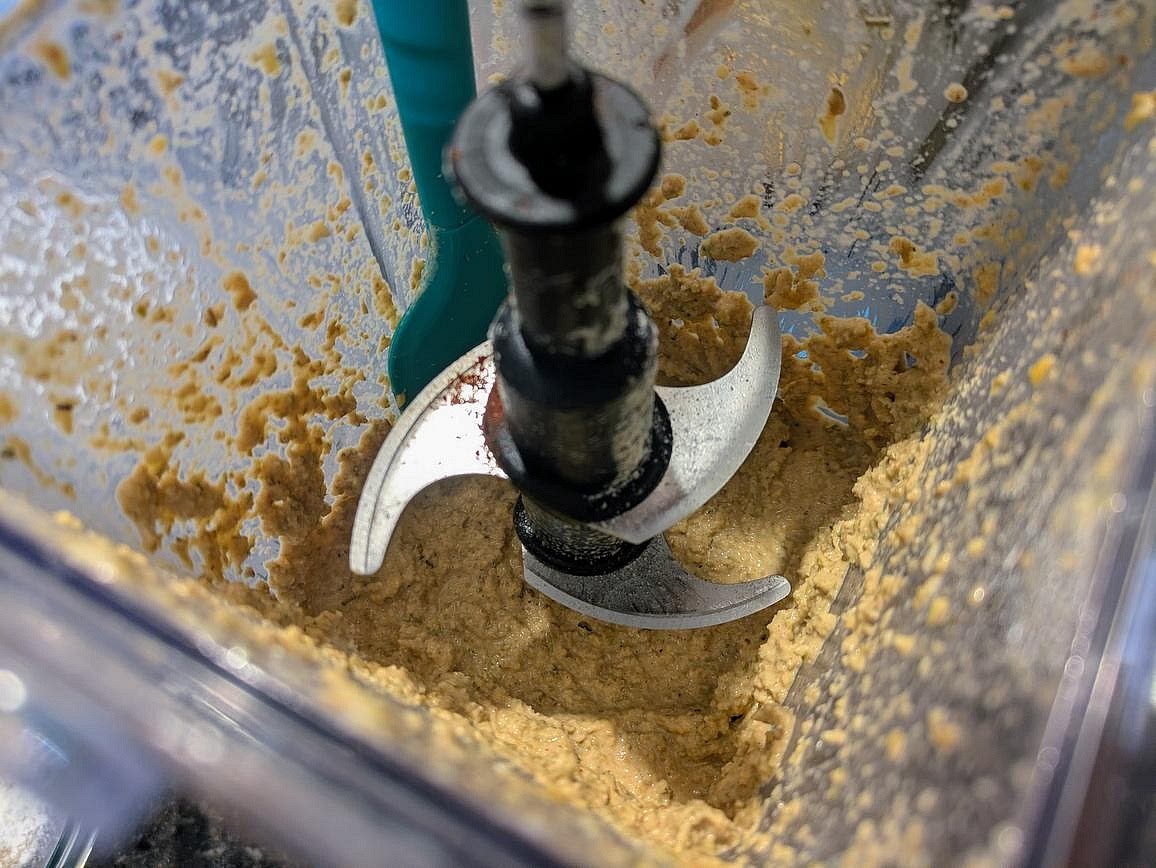 Add your lentils and soaking liquid to a blender with oil, yogurt, salt, paprika, garlic powder, onion powder, and rosemary. Blend until smooth.